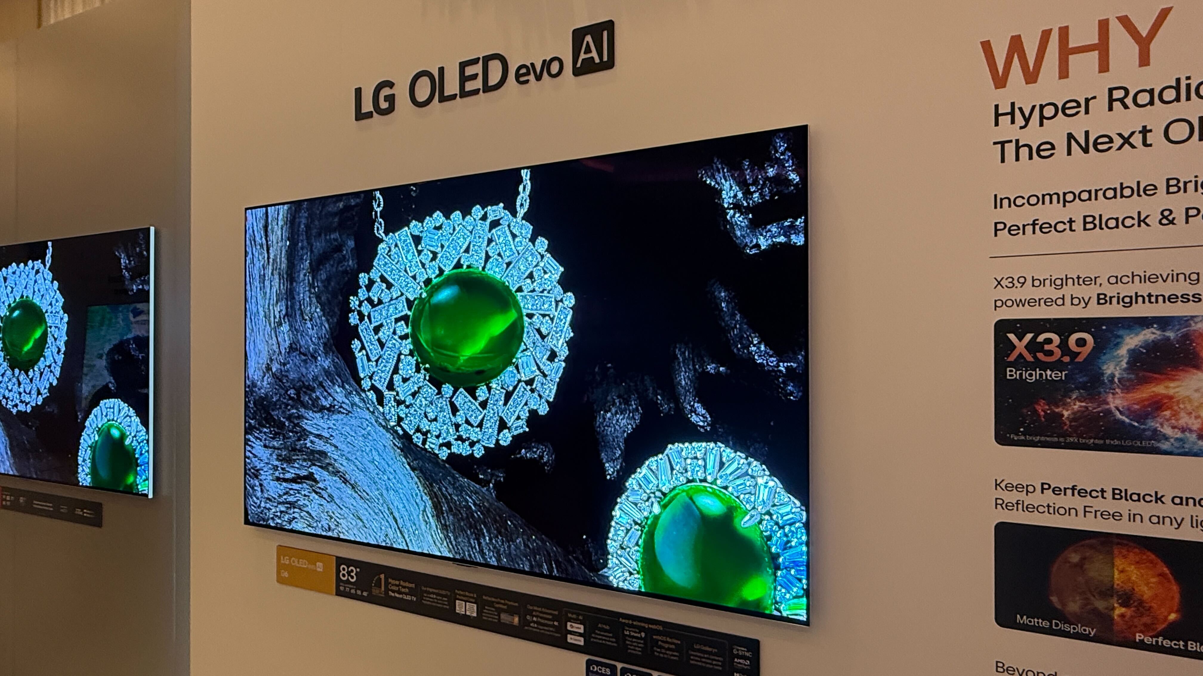 A wall mounted LG G6 OLED TV with LG demo content on screen
