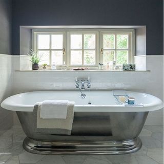 bathroom with upper wall and ceiling black and lower wall gloosy white