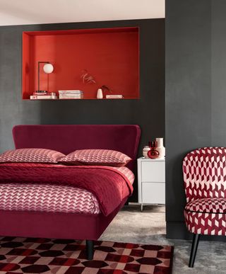 bedroom with inset shelf painted red