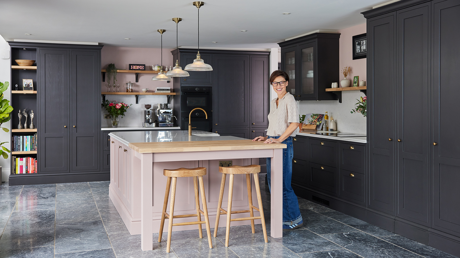 Emma Willis kitchen with charcoal grey cabinets and dusky pink island