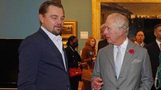 Prince Charles, Prince of Wales speaks to Leonardo DiCaprio as he views a fashion installation by designer Stella McCartney, at the Kelvingrove Art Gallery and Museum, during the Cop26 summit being held at the Scottish Event Campus (SEC) on November 3, 2021 in Glasgow, Scotland