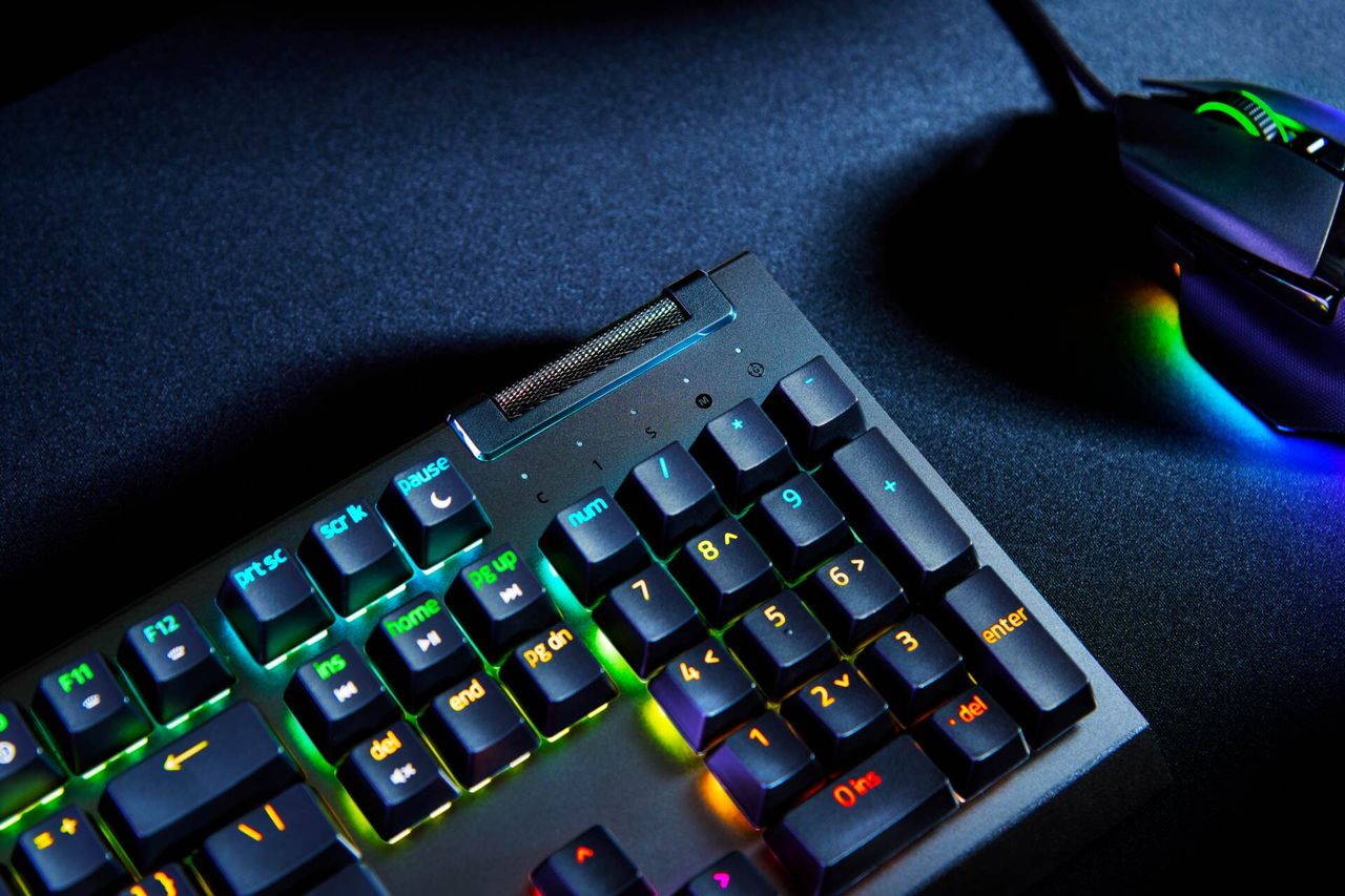Razer Blackwidow V4 X next to a Razer mouse