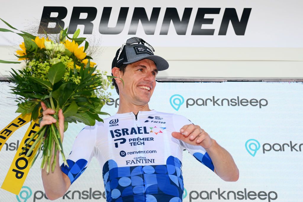 BRUNNEN SWITZERLAND JUNE 15 Daryl Impey of South Africa and Team Israel Premier Tech celebrates winning the stage on the podium ceremony after the 85th Tour de Suisse 2022 Stage 4 a 1908km stage from Grenchen to Brunnen ourdesuisse2022 WorldTour on June 15 2022 in Brunnen Switzerland Photo by Tim de WaeleGetty Images
