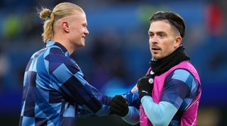 Erling Haaland and Jack Grealish of Manchester City interact during the warm-up prior to the UEFA Champions League quarter-final first leg match between Manchester City and Bayern Munich at the Etihad Stadium on April 11, 2023 in Manchester, England.