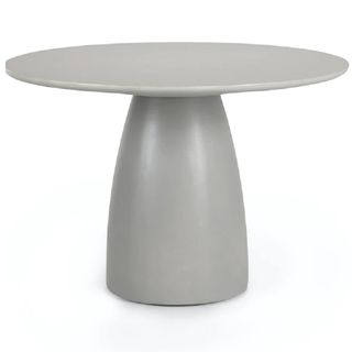 An outdoor plinth-like dining table