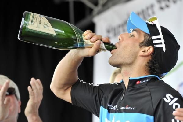 Davide Appollonio takes a big drink of his first podium champagne as a pro