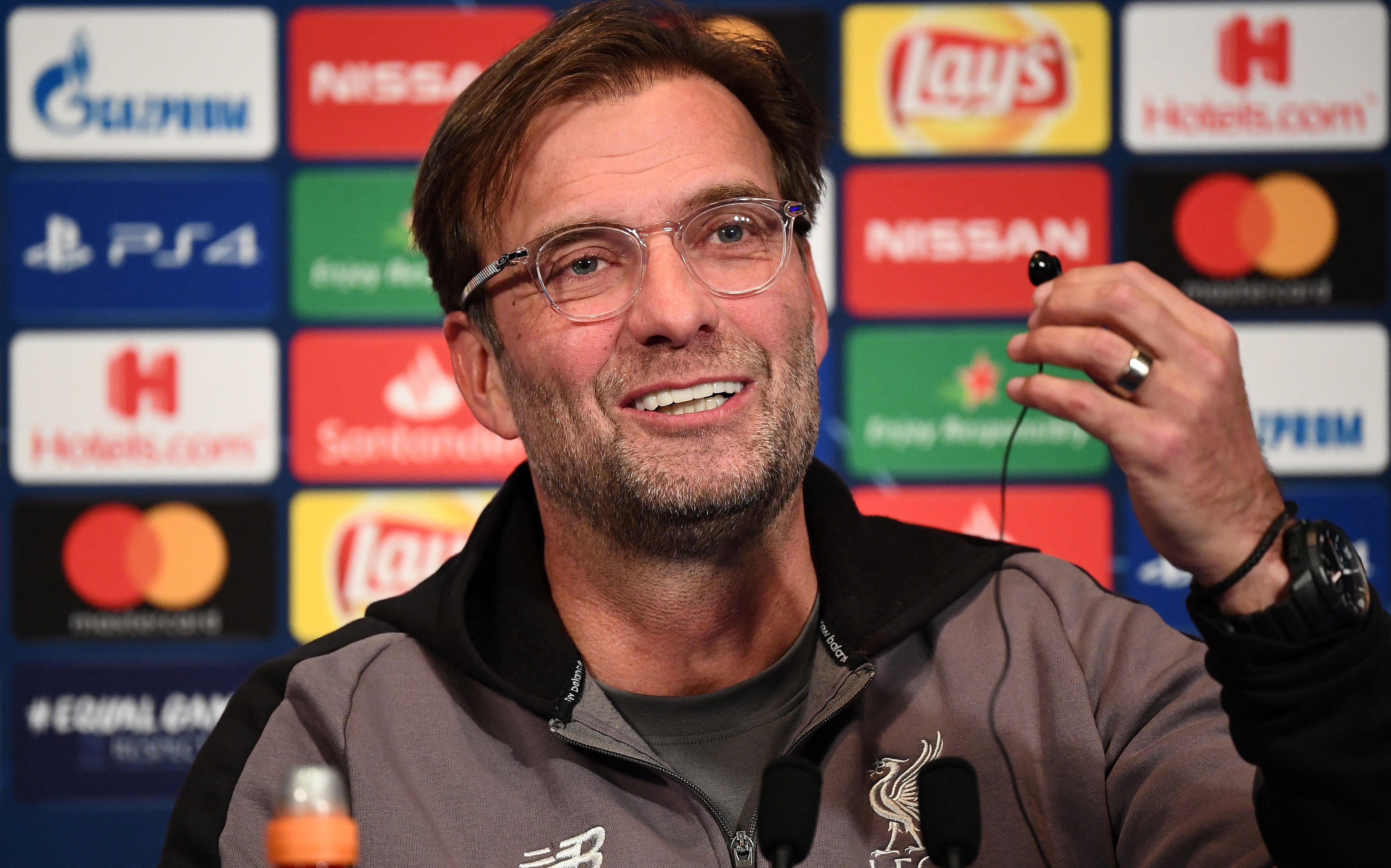 Liverpool manager Jurgen Klopp jokes during a press conference ahead of a Champions League game against Paris Saint-Germain in November 2018.