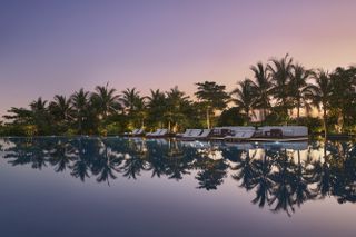 The Riviera Maya Edition at Kanai pool with palm trees