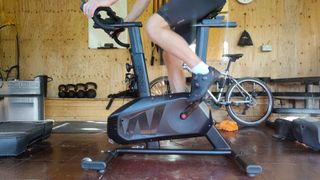 Wattbike Proton being ridden in a home gym