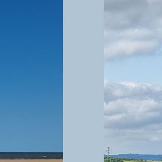 Dulux colour Bright Skies compared against a clear blue sky near the horizon with hardly any water vapour (left) and a cloudier sky indicating higher levels of water vapour (right).