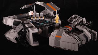 A Lego spaceship being pulled apart