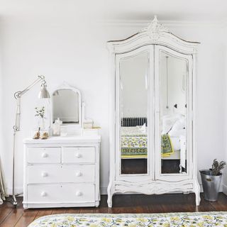 white traditional bedroom with armoire
