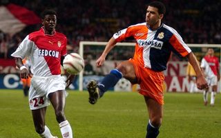 AS Monaco Togolese forward Emmanuel Adebayor (L) fights for the ball Deportivo la Coruna defender Nourredine Naybet (R), 05 November 2003, at the Louis II stadium in Monaco during their UEFA Champions League, group C match. AFP PHOTO PASCAL GUYOT/pg (Photo by Pascal GUYOT / AFP) (Photo by PASCAL GUYOT/AFP via Getty Images)