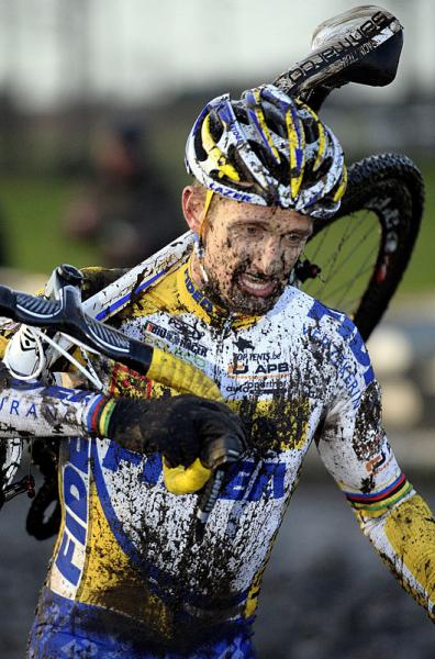 Bart Wellens (Telenet-Fidea) runs with his bike