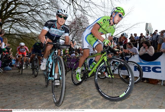 Matteo Trentin (Omega Pharma-QuickStep) and Peter Sagan (Cannondale) tackle the cobbles during Gent-Wevelgem