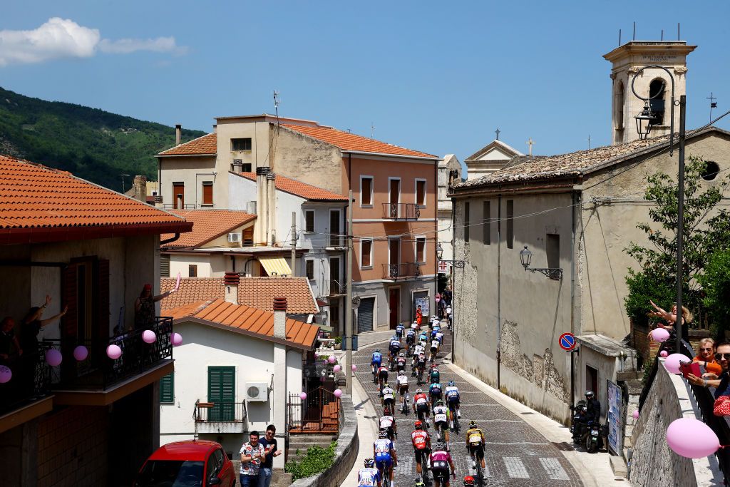 BLOCKHAUS ITALY MAY 15 A general view of the peloton compete passing through Fara San Martino village landscape during the 105th Giro dItalia 2022 Stage 9 a 191km stage from Isernia to Blockhaus 1664m Giro WorldTour on May 15 2022 in Blockhaus Italy Photo by Michael SteeleGetty Images
