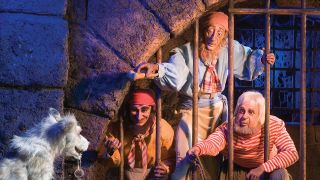 Pirates in jail, dog holding key in Pirates of the Caribbean