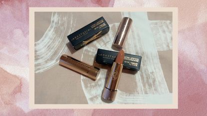 an image of Anastasia Beverly Hills Satin Lipstick in Praline on a pink ombre background