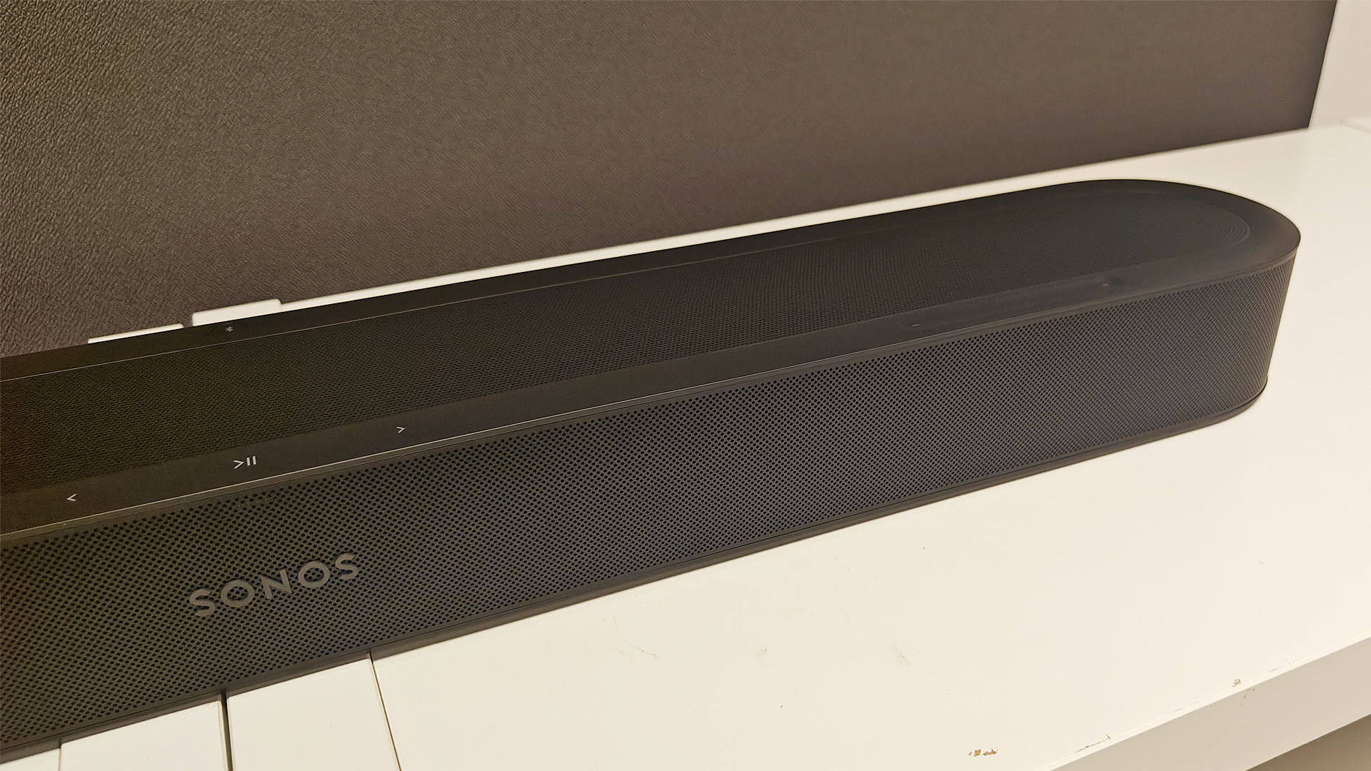 Sonos Beam Ultra Dolby Atmos soundbar on white wooden shelving unit