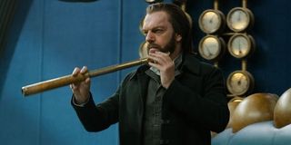 Mortal Engines Hugo Weaving raising his spyglass to spot his prey