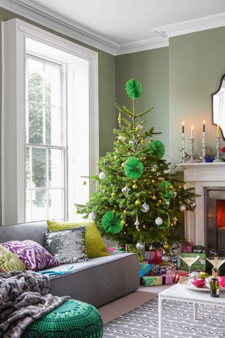 Christmas tree decorated with green paper Christmas decorations