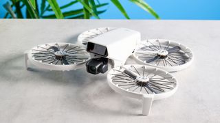 A gray DJI Flip drone with propeller guards