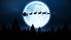 Santa riding sleigh past the moon