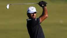 Aaron Rai holds his finish on an iron shot