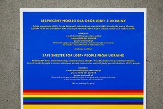 A notice offering safe shelter for LGBT+ people from Ukraine is seen at the main railway station in Krakow, Poland on March 7, 2022. Russian invasion on Ukraine can cause a mass exodus of refugees to Poland.