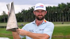 Cameron Young with the Cadillac Championship trophy