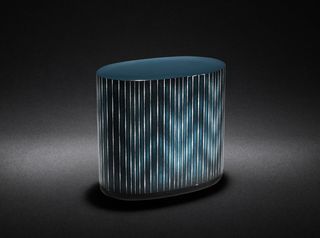 View of the teal, oval-shaped 'Shiraito' lacquered box pictured against a black background