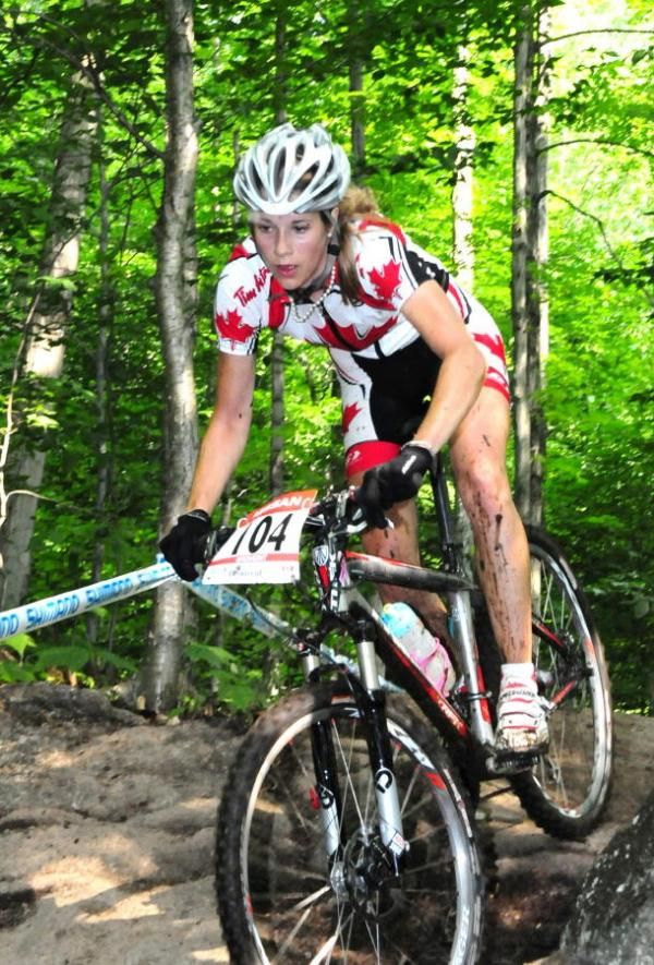 Cayley Brooks descending over some rocks.