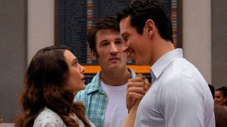 Elizabeth Olsen and Callum Turner look into each others' eyes while Miles Teller looks on in disgust