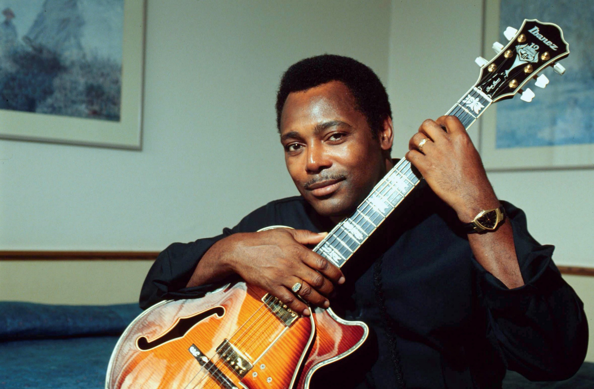 George Benson poses with one of his Ibanez guitars backstage at the North Sea Jazz Festival in The Hague, Netherlands on July 14, 2001