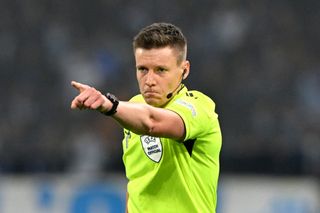 Referee Daniel Siebert gesturesduring the UEFA Europa League 2023/24 Semi-Final first leg match between Olympique de Marseille and Atalanta BC at Stade de Marseille on May 02, 2024 in Marseille, France. (Photo by Chris Ricco/Getty Images)