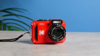 A red Kodak PIXPRO WPZ2 compact camera