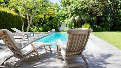 swimming pool with chairs