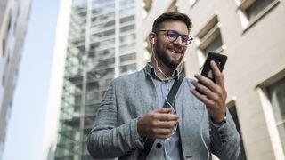 A man taking a video call while walking outside.