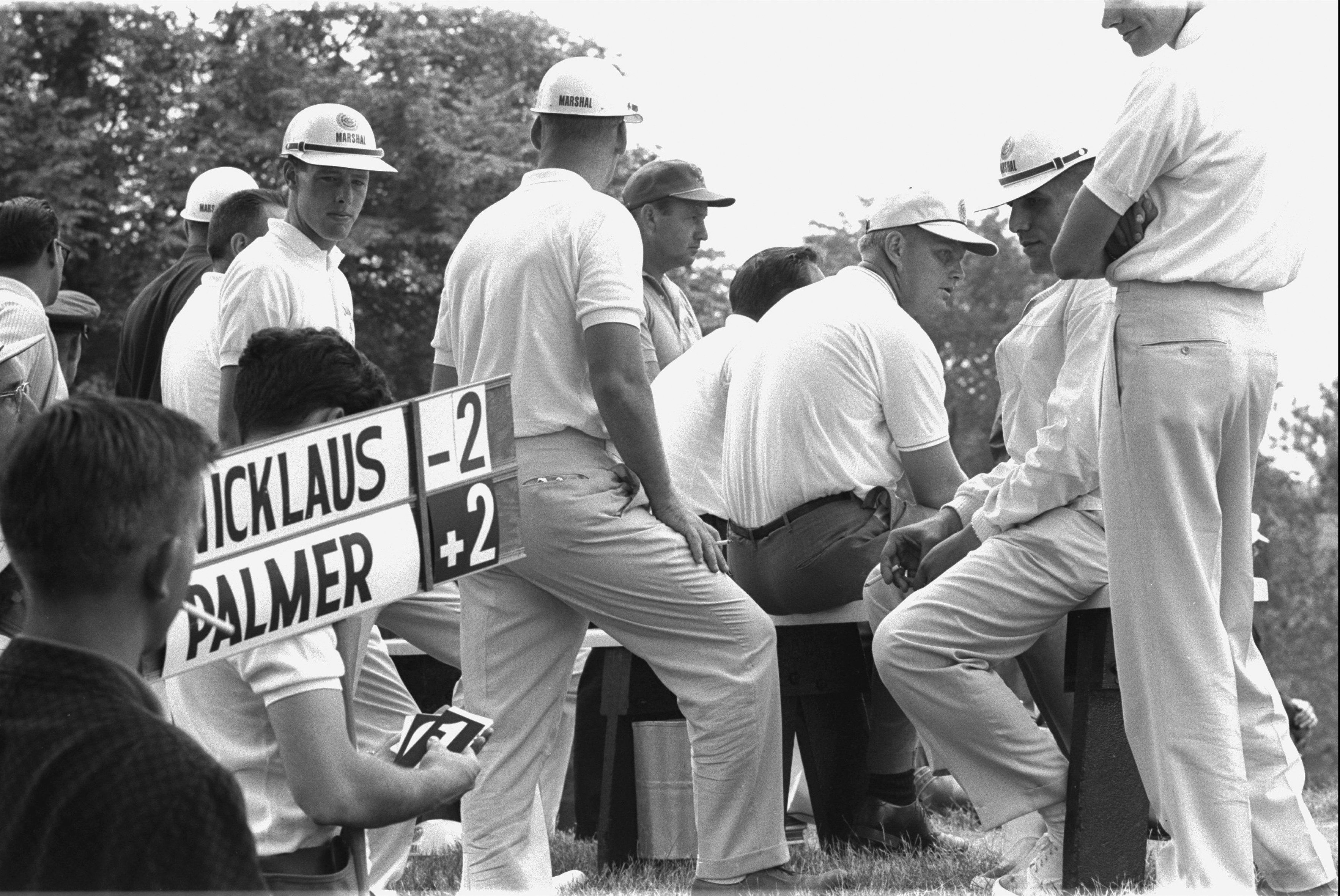 A leaderboard displays Jack Nicklaus and Arnold Palmer's name during the 1962 US Open