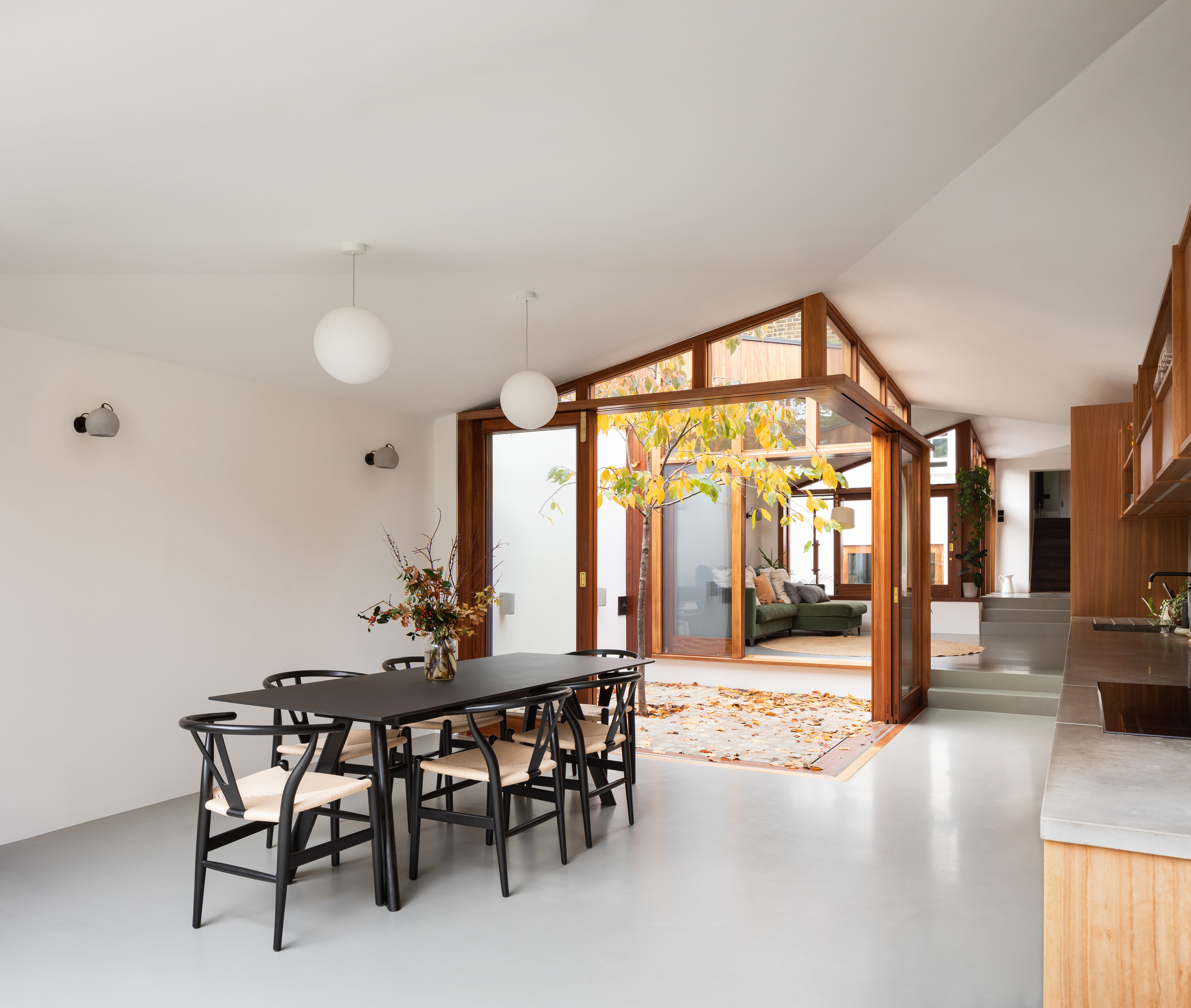 an open plan kitchen with internal courtyard gardens
