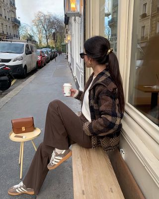 woman wearing suede sneakers