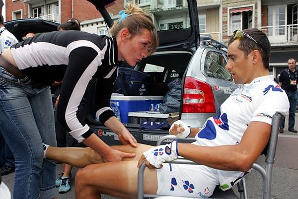 An FDJ rider gets his morning rub down.
