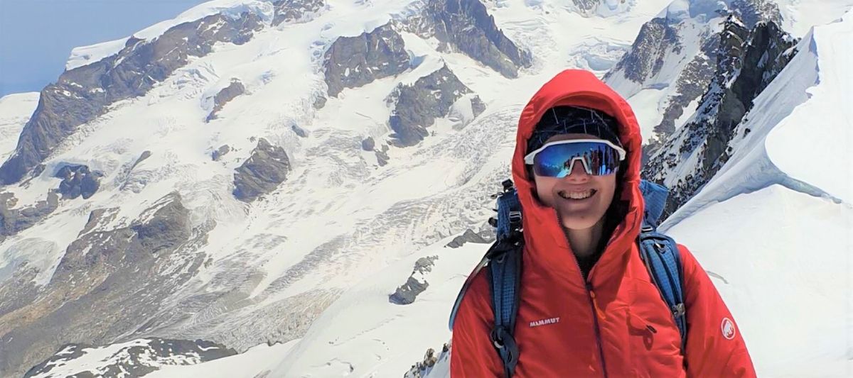 Woman on mountain wearing SunGod Velans sunglasses