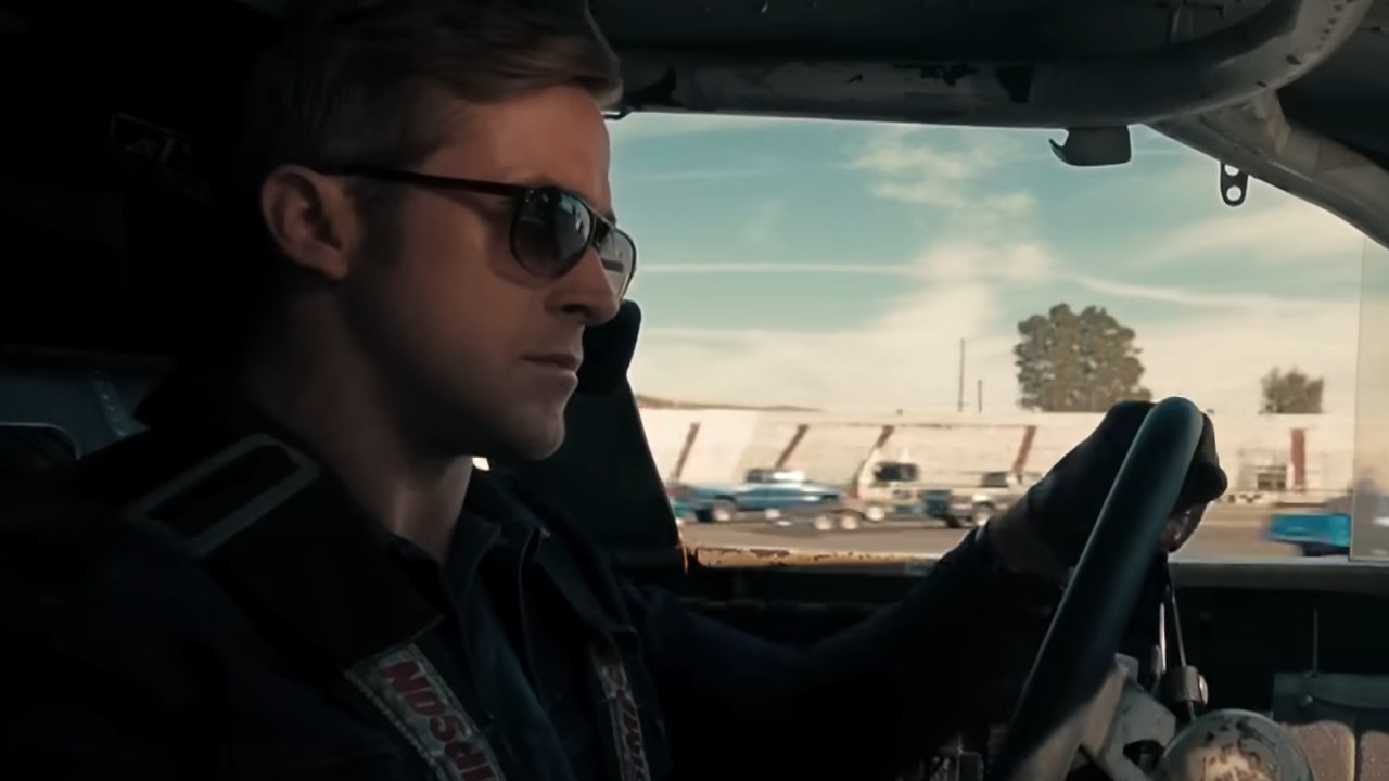Ryan Gosling behind the wheel with sunglasses on in Drive