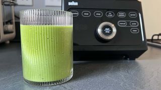 green smoothie in glass ready to drink
