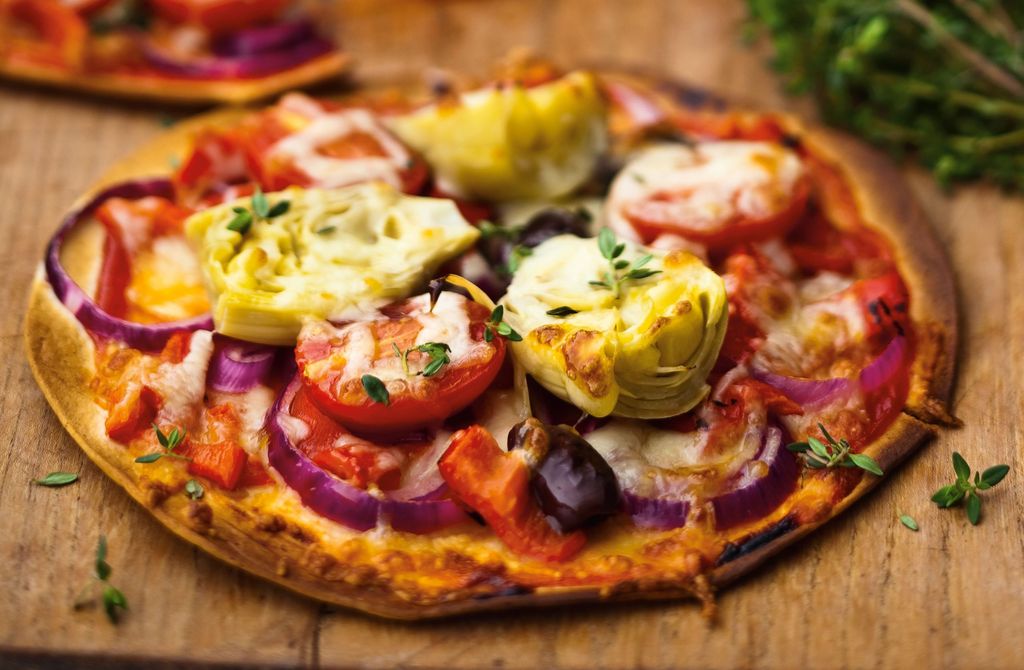 Red onion, artichoke and tomato pizza Italian Recipes GoodtoKnow