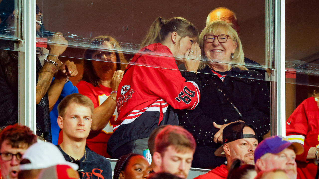 Taylor Swift and Donna Kelce talk before the game between the Kansas City Chiefs and the Denver Broncos at GEHA Field at Arrowhead Stadium on October 12, 2023 in Kansas City, Missouri.