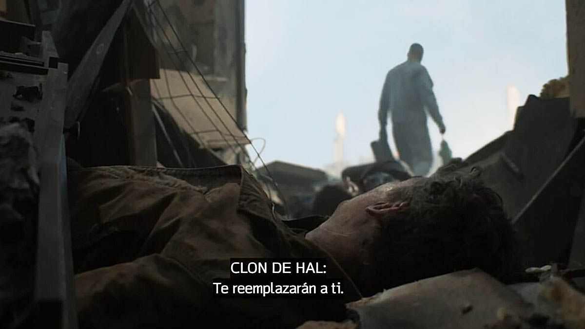 A shot of Hal Jordan surrounded by rubble as John Stewart walks away, and some white subtitles on the screen, in Lanterns episode 5
