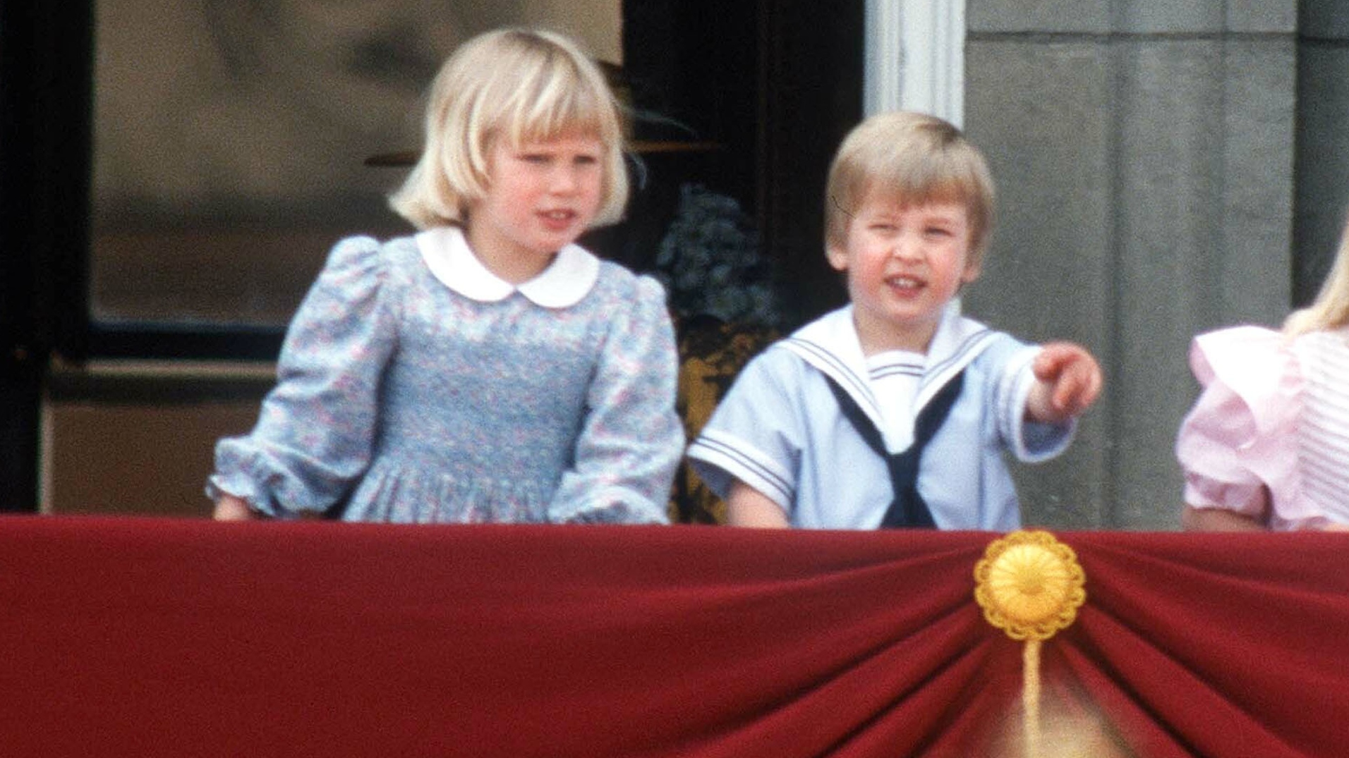 Zara and Prince William stand on the balcony of Buckingham Palace during Trooping the Colour on June 15, 1985