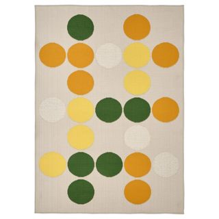 indoor outdoor rug with yellow, orange and green spots